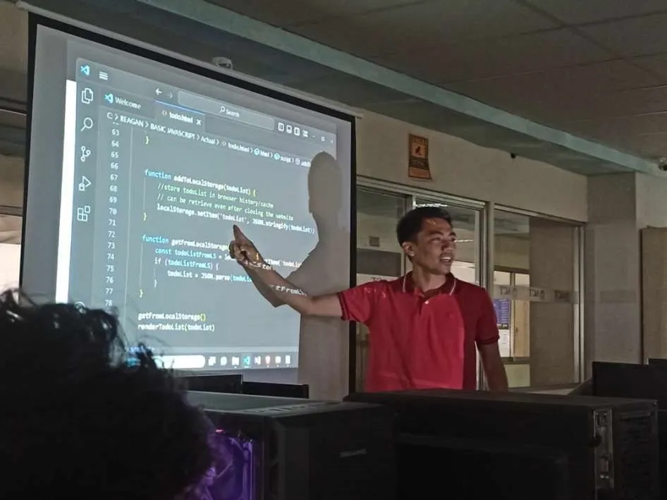 KaSocius founder engaging students while discussing JavaScript programming concepts